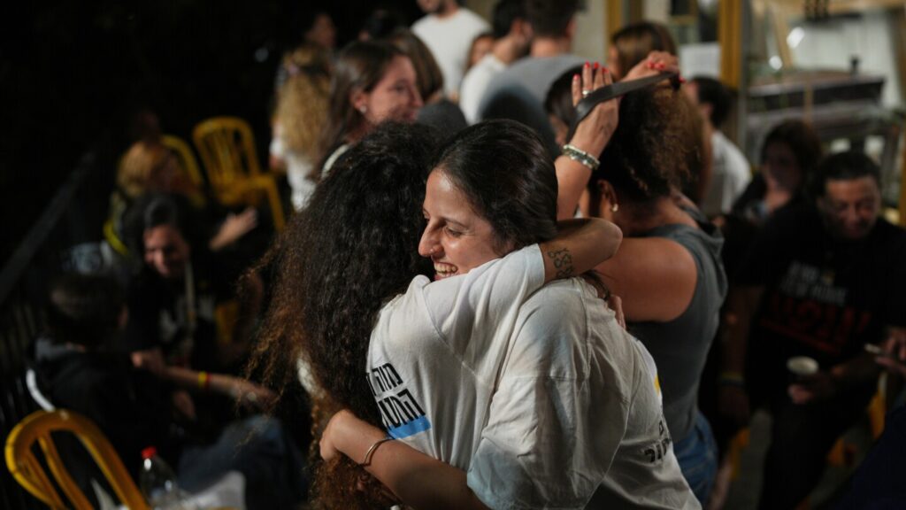 Photos show Palestinians and Israelis reacting to peace deal announcement