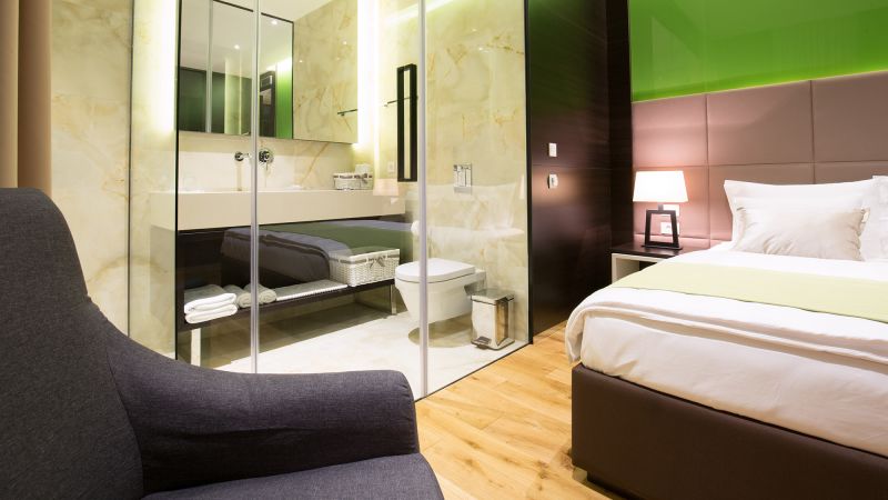 Travelers have had enough. It’s time to make hotel room bathrooms private again.